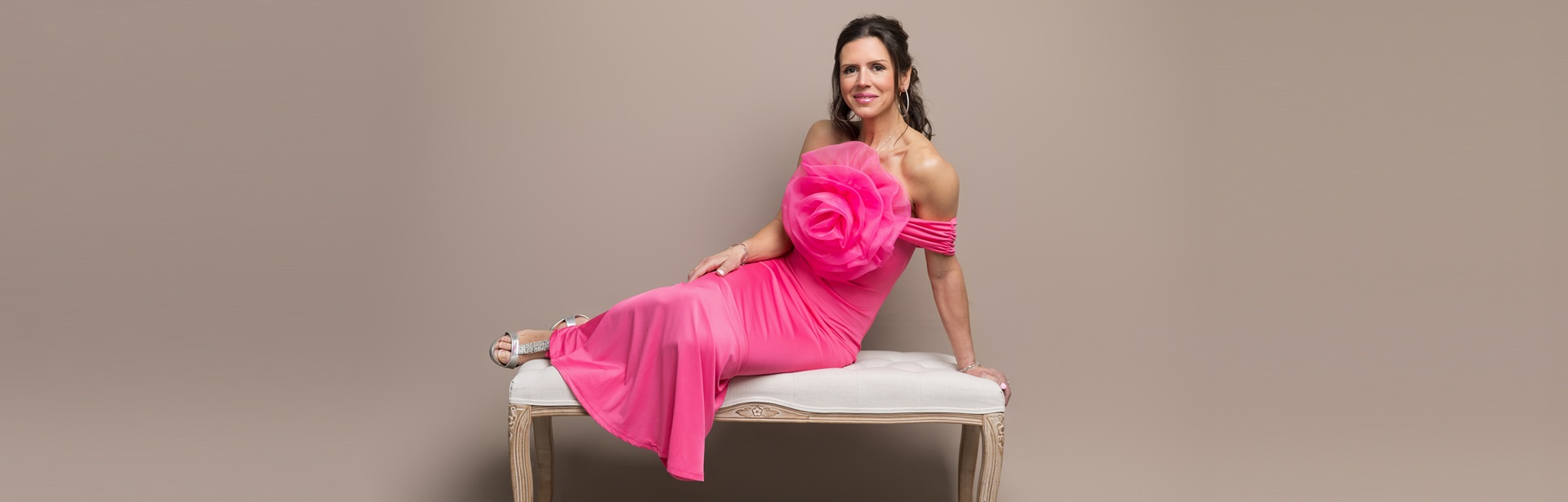 Woman Sitting with Sign on Government Building Steps